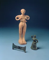 Double axehead and two figurines from Knossos, late Minoan, c.1500 BC